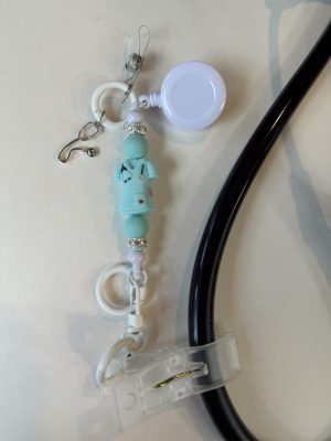 Light blue scrub top clip with stethoscope charm