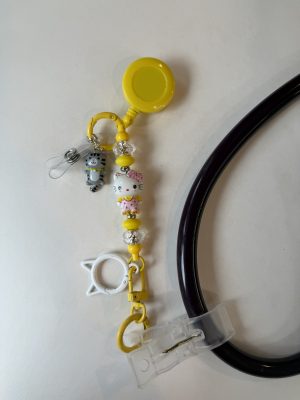 Yellow Hello Kitty clip with cat O-ring and grey cat charm