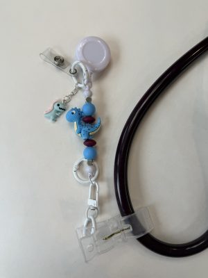 Black clip with white doctor lab coat and silver stethoscope charm